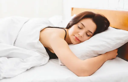 A woman sleeping peacefully in bed 